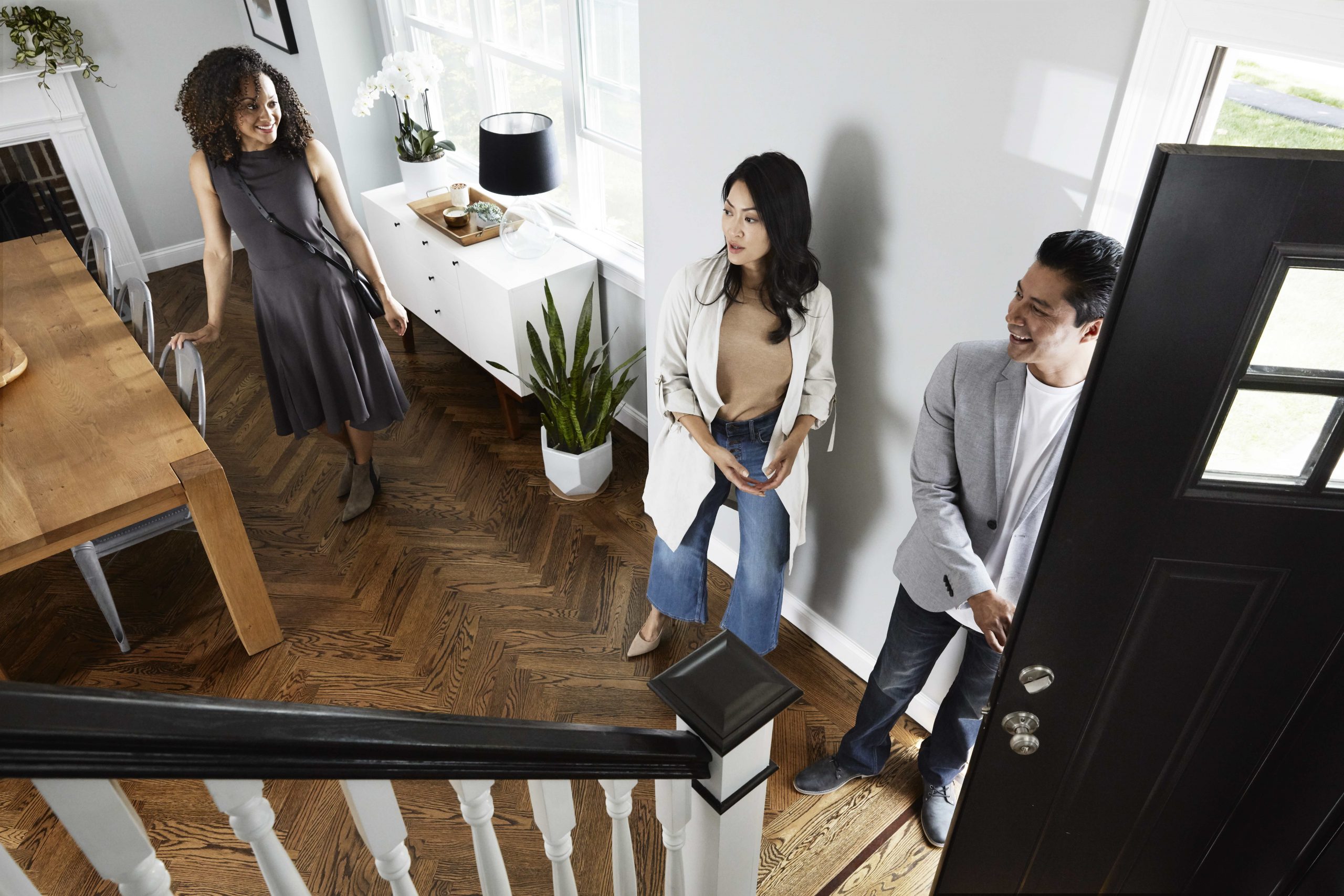 Agent showing homes for sale to clients